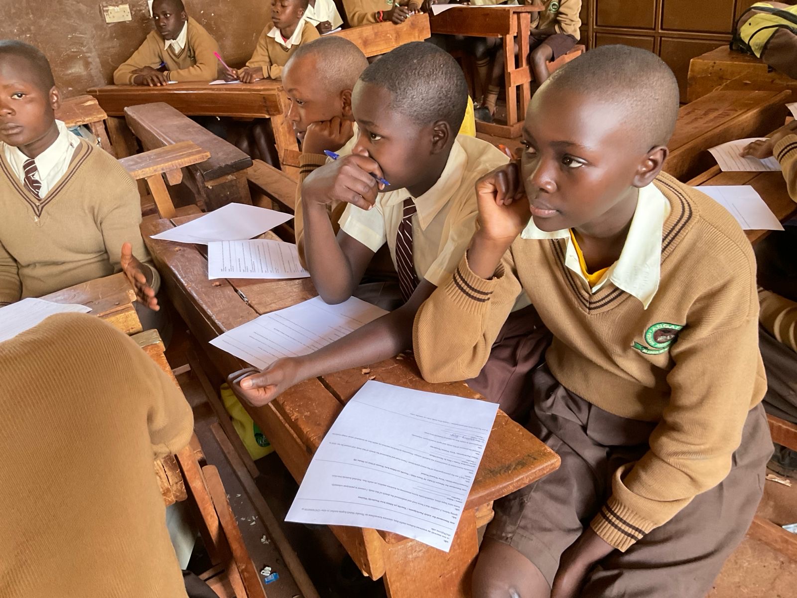 Students and community members participating in tree planting ceremony at Utando Kenya project