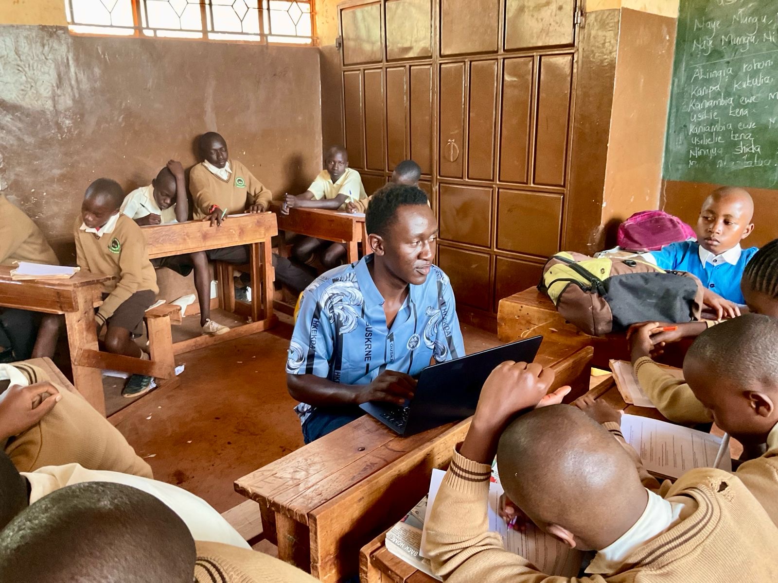 Community members receiving computer equipment for digital literacy program